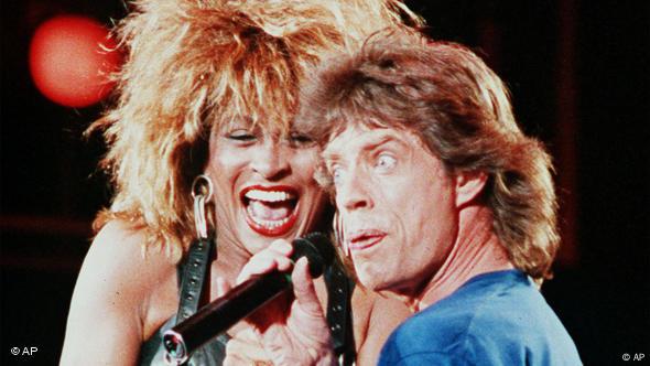 Tina Turner performs with Mick Jagger at the Live Aid concert in Philadelphia in 1995