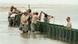 Members of the U.S. Army National Guard B Company 711 put Hesco containers along the beaches of Dauphin Island, Ala., Sunday, May 2, 2010