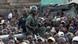 Ivory Coast soldiers stand guard during a youth rally